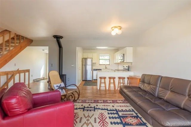 a living room with furniture and a rug