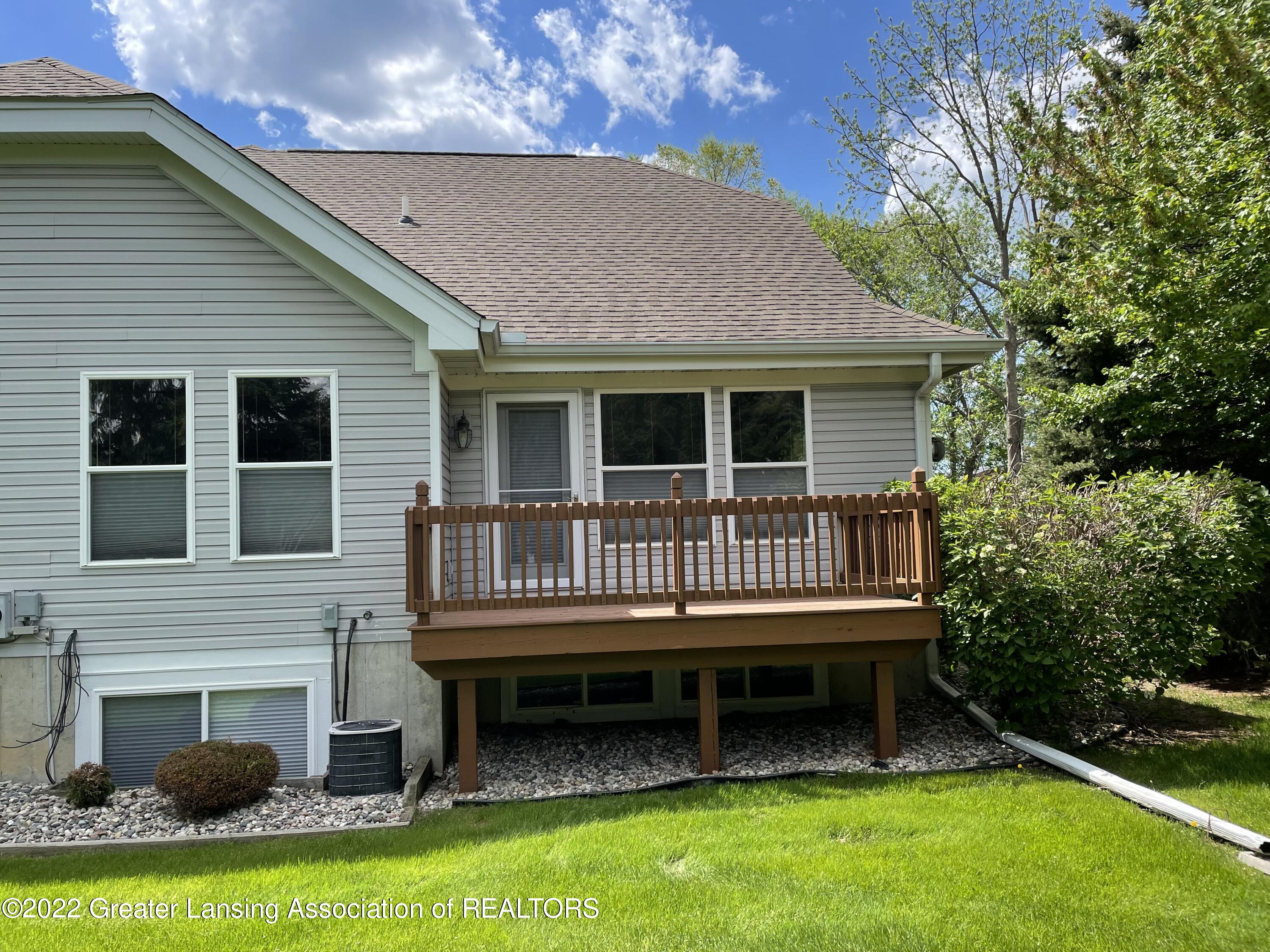 2415 North Aurelius Road, Unit 45 Holt, MI 48842 - Photo 6 of 37 Back Deck