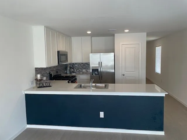 a bathroom with a sink double vanity and a mirror