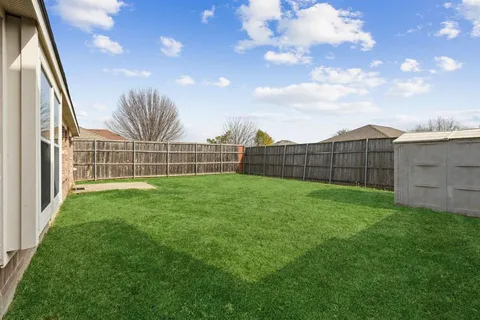 a view of a backyard with a garden