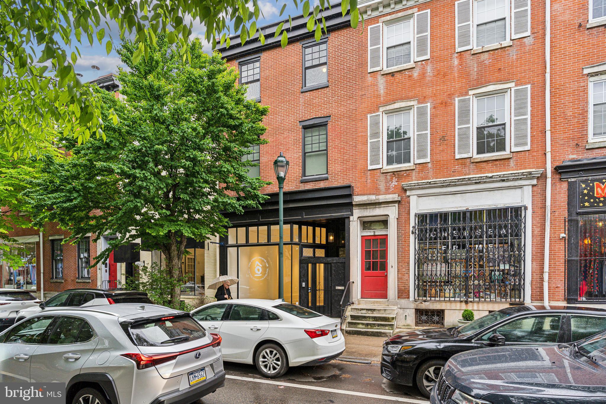 1108 Pine Street, Unit 3F Philadelphia, PA 19107 - Photo 3 of 8 a car parked in front of a brick building