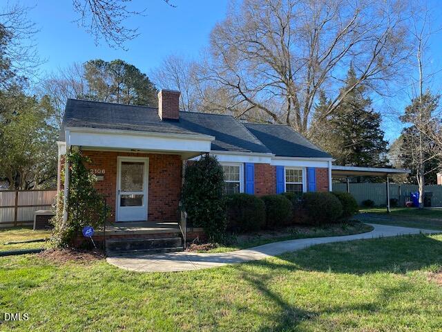 2106 Tudor Place Raleigh, NC 27610 - Photo 1 of 16 front view of a house with a yard