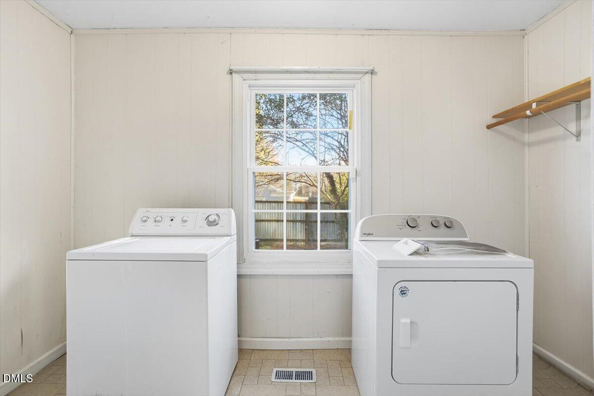 2106 Tudor Place Raleigh, NC 27610 - Photo 9 of 16 a utility room with dryer and washer