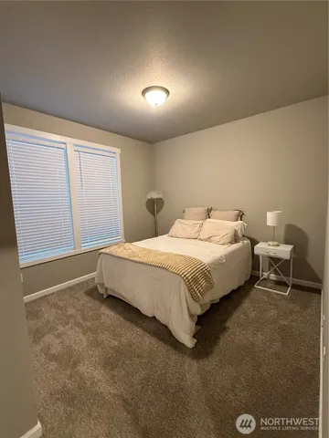 a bedroom with a bed and a closet