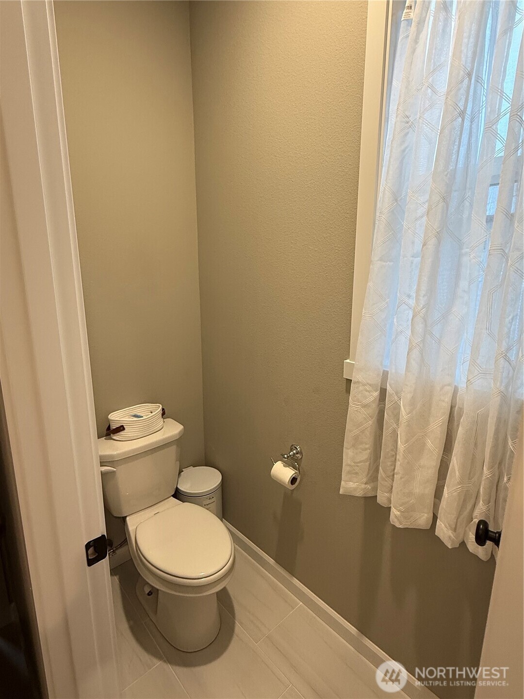 7013 South Hyton Street Cheney, WA 99004 - Photo 7 of 27 a white toilet sitting next to a sink