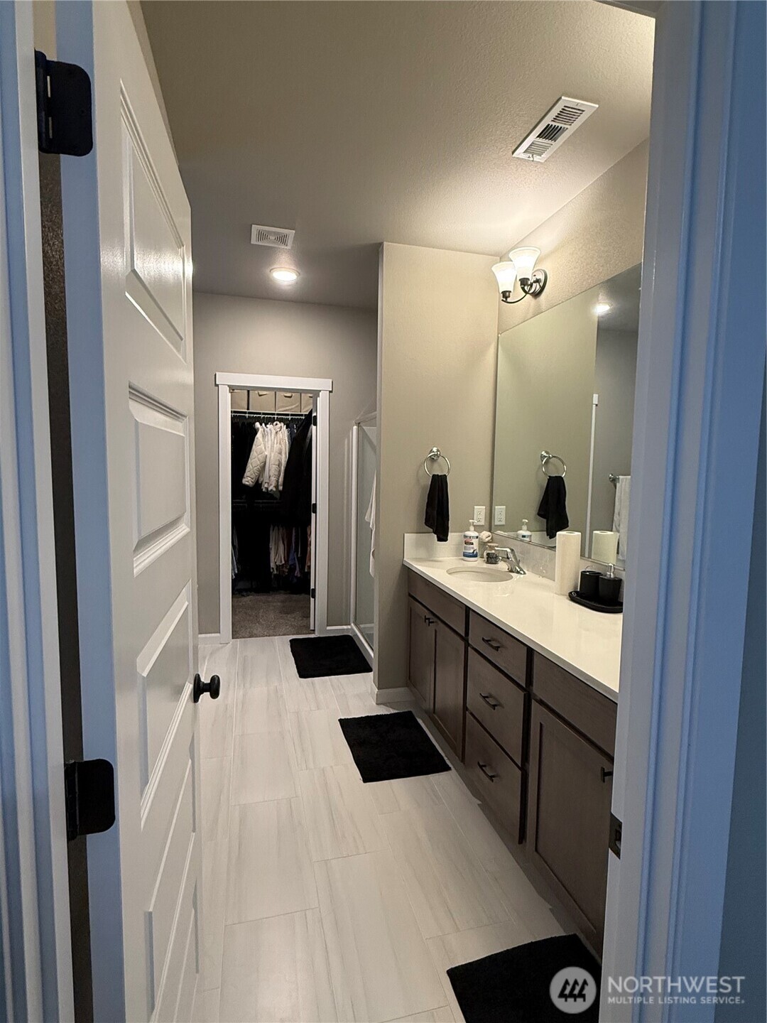 7013 South Hyton Street Cheney, WA 99004 - Photo 8 of 27 a bathroom with a sink a toilet and shower