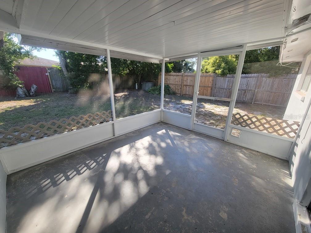 7922 Kelpie Drive Port Richey, FL 34668 - Photo 23 of 24 a view of a porch with a garden