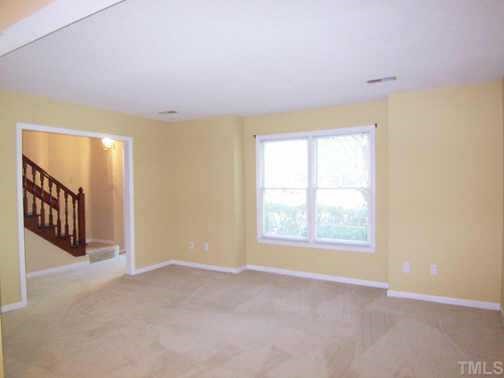 1505 Edgeside Court Raleigh, NC 27609 - Photo 3 of 10 an empty room with windows