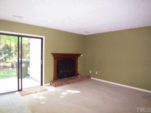 1505 Edgeside Court Raleigh, NC 27609 - Photo 6 of 10 a view of empty room with floor to ceiling window