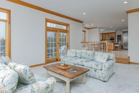 a living room with furniture and a table