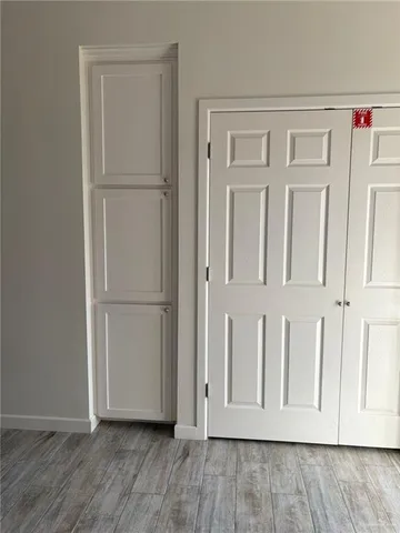 a view of a livingroom with wooden floor