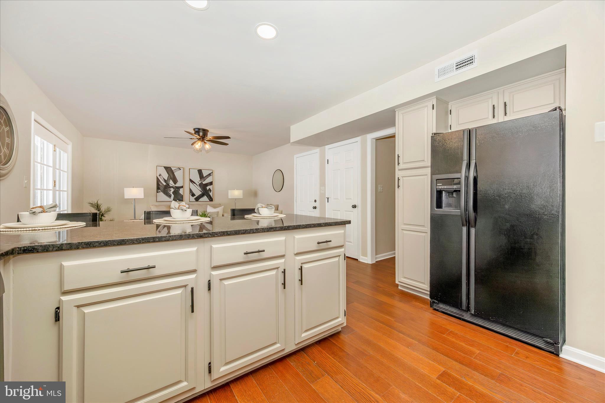 6630 Fox Meade Court Frederick, MD 21702 - Photo 21 of 84 a kitchen with stainless steel appliances granite countertop a refrigerator and white cabinets
