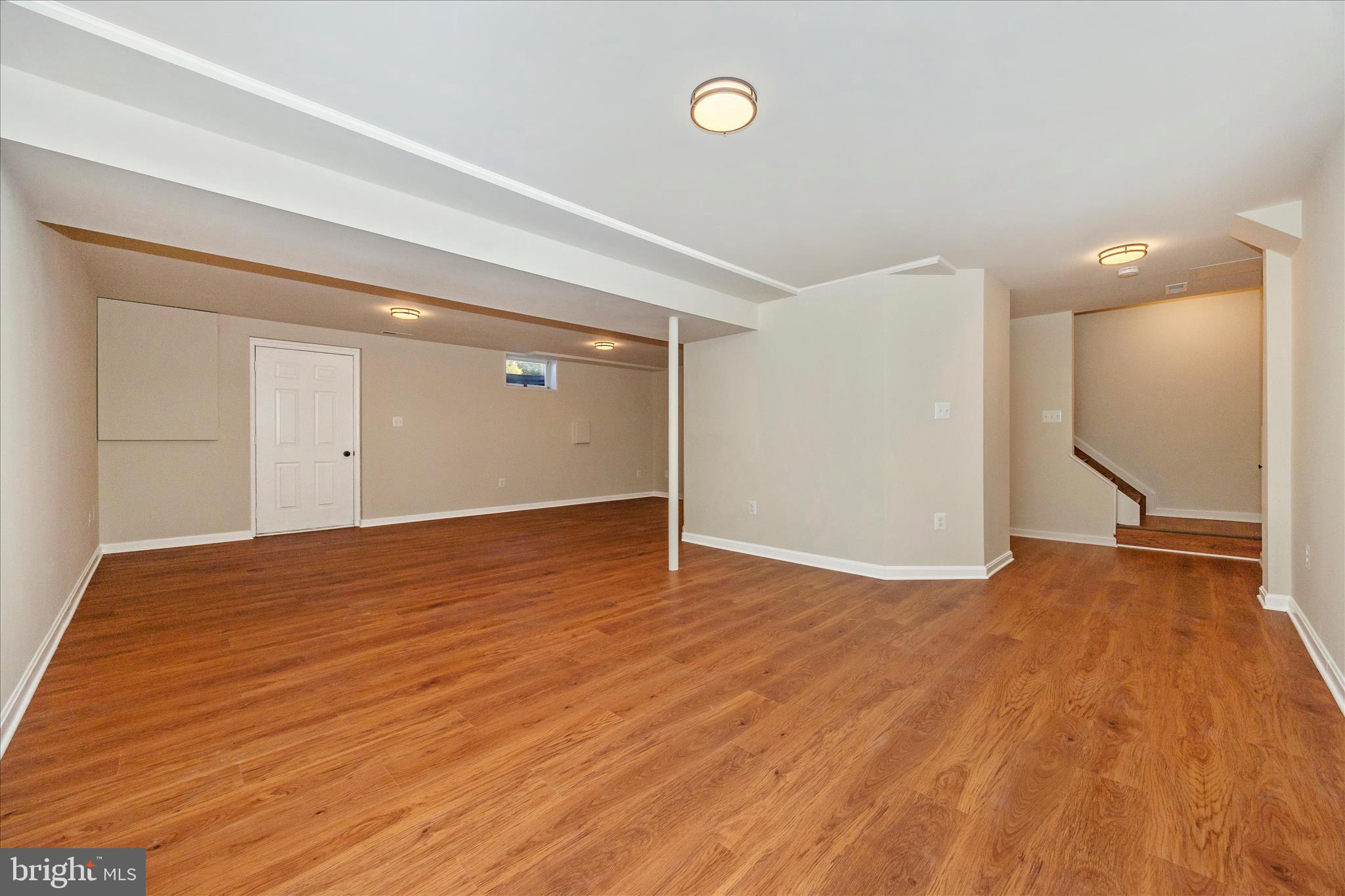 6630 Fox Meade Court Frederick, MD 21702 - Photo 46 of 84 a view of an empty room with wooden floor