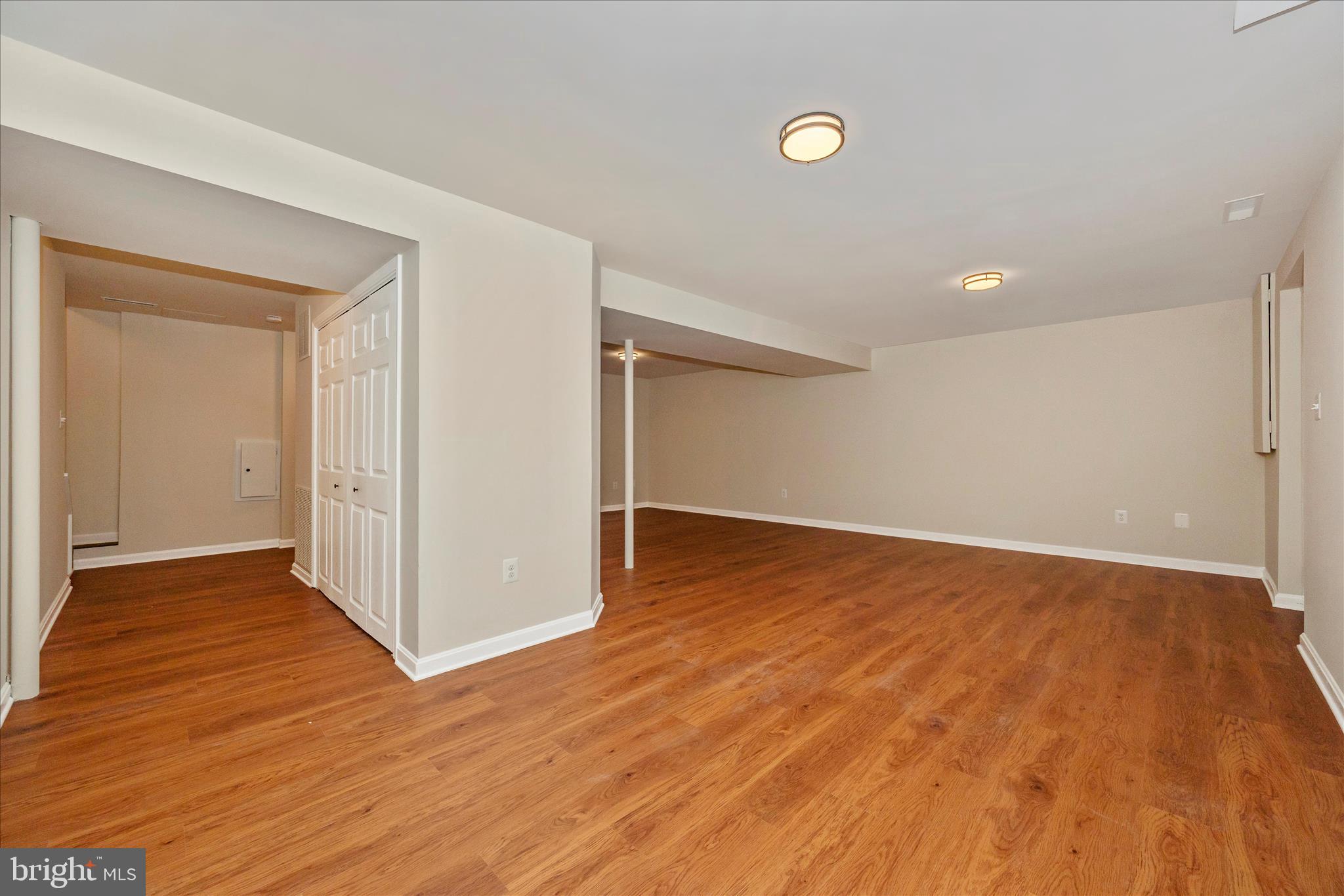6630 Fox Meade Court Frederick, MD 21702 - Photo 48 of 84 a view of an empty room with wooden floor
