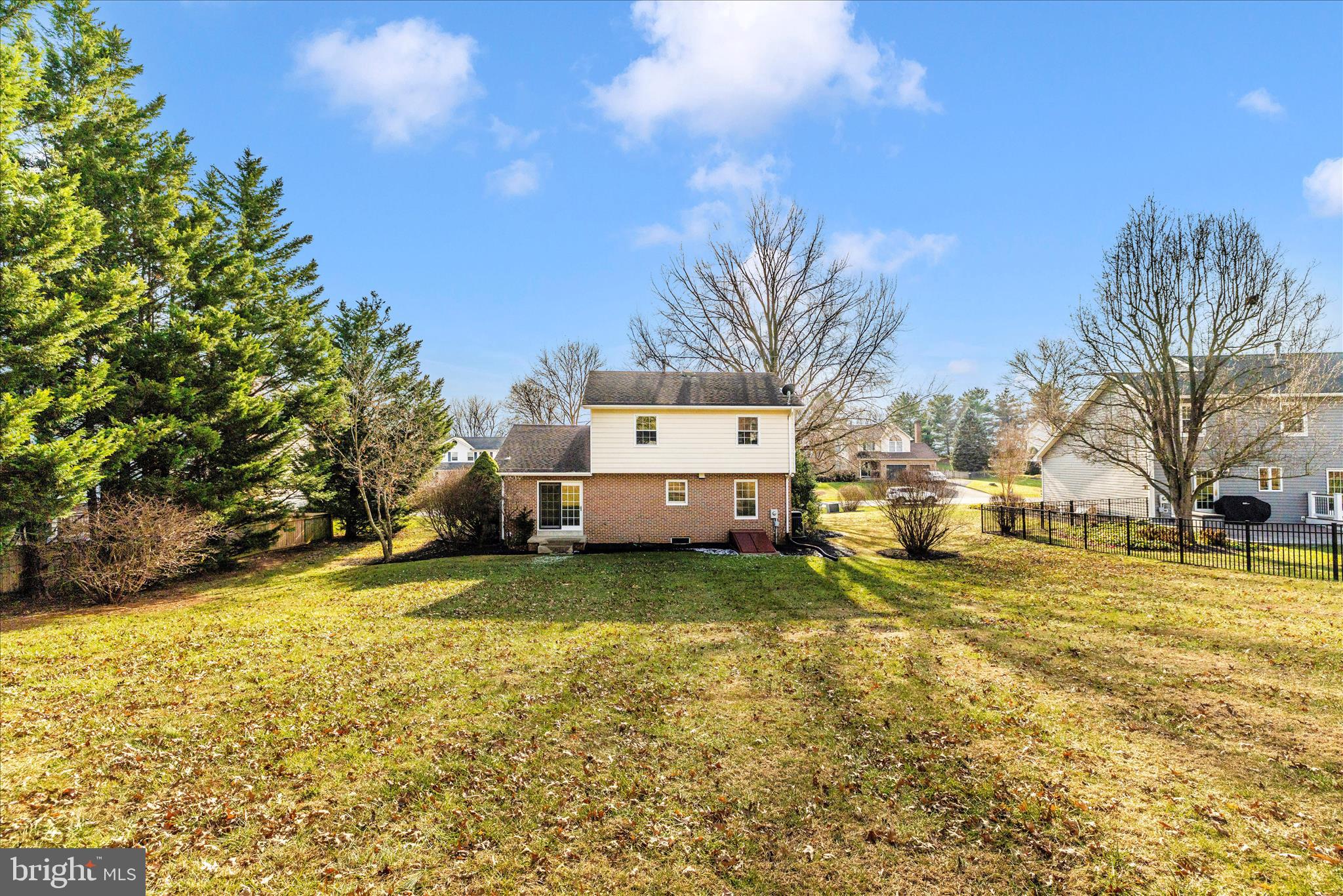 6630 Fox Meade Court Frederick, MD 21702 - Photo 51 of 84 a yellow house sitting in middle of a yard