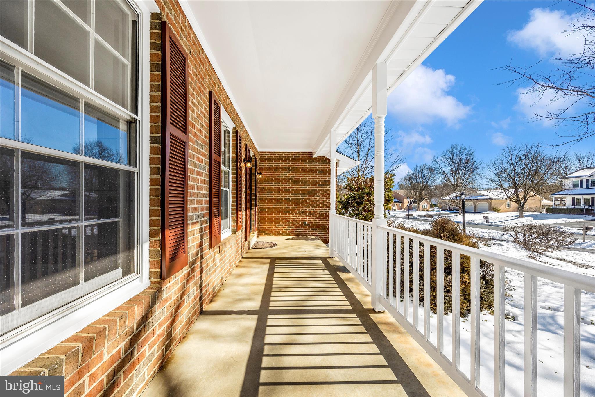 6630 Fox Meade Court Frederick, MD 21702 - Photo 56 of 84 a view of a balcony with wooden floor and fence