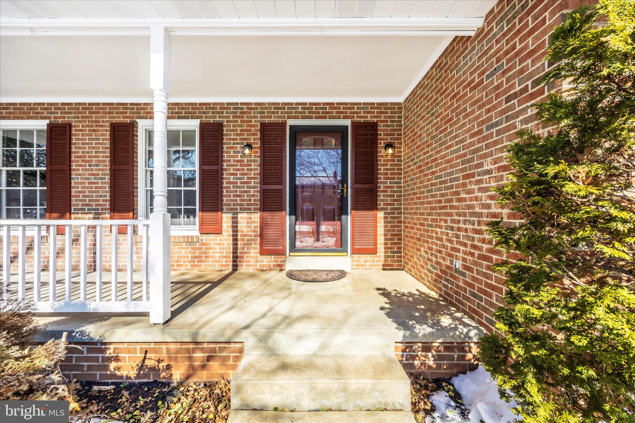 6630 Fox Meade Court Frederick, MD 21702 - Photo 6 of 84 a view of a brick house with a large window