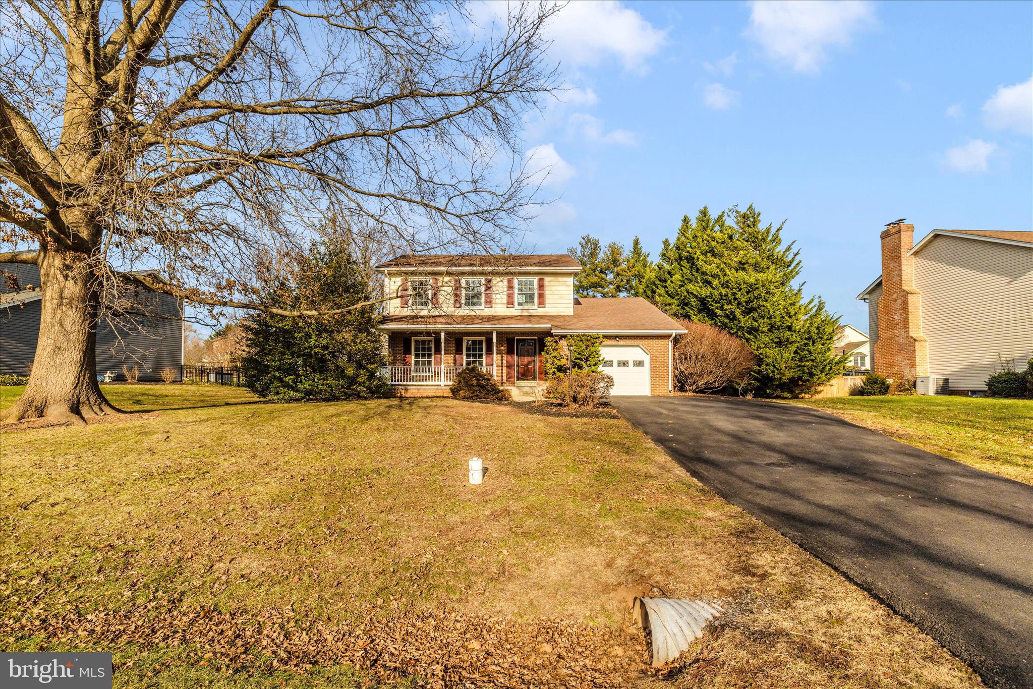 6630 Fox Meade Court Frederick, MD 21702 - Photo 65 of 84 a front view of a house with a yard and garage