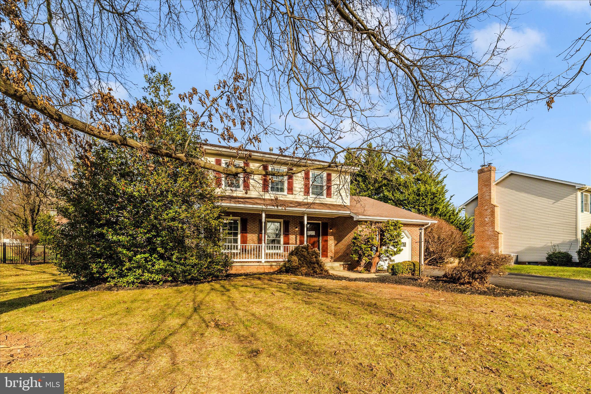 6630 Fox Meade Court Frederick, MD 21702 - Photo 66 of 84 a view of a white house with a large tree in front of it