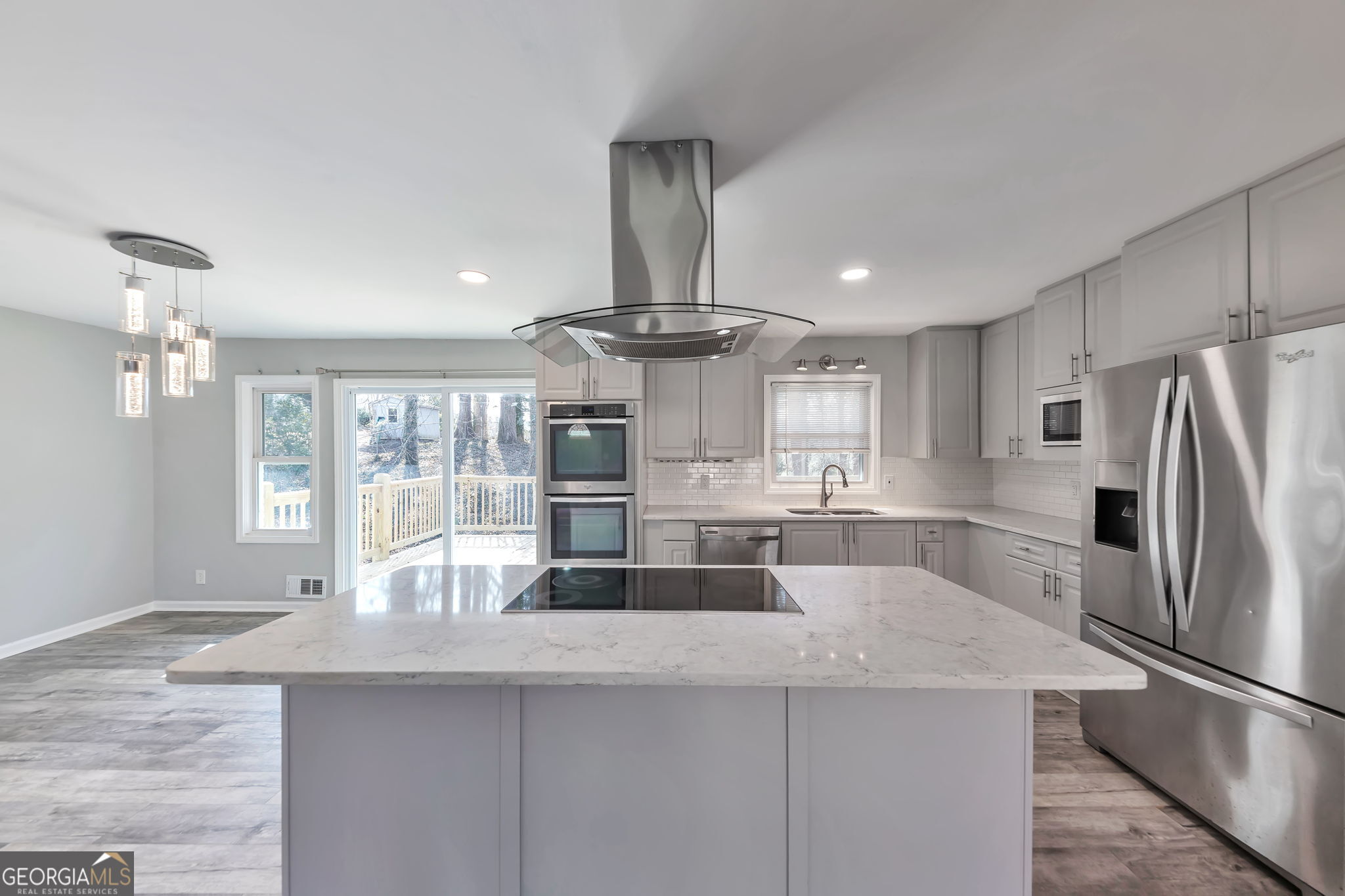 2764 Veltre Place Southwest Atlanta, GA 30311 - Photo 11 of 30 a kitchen with stainless steel appliances granite countertop a sink and a refrigerator