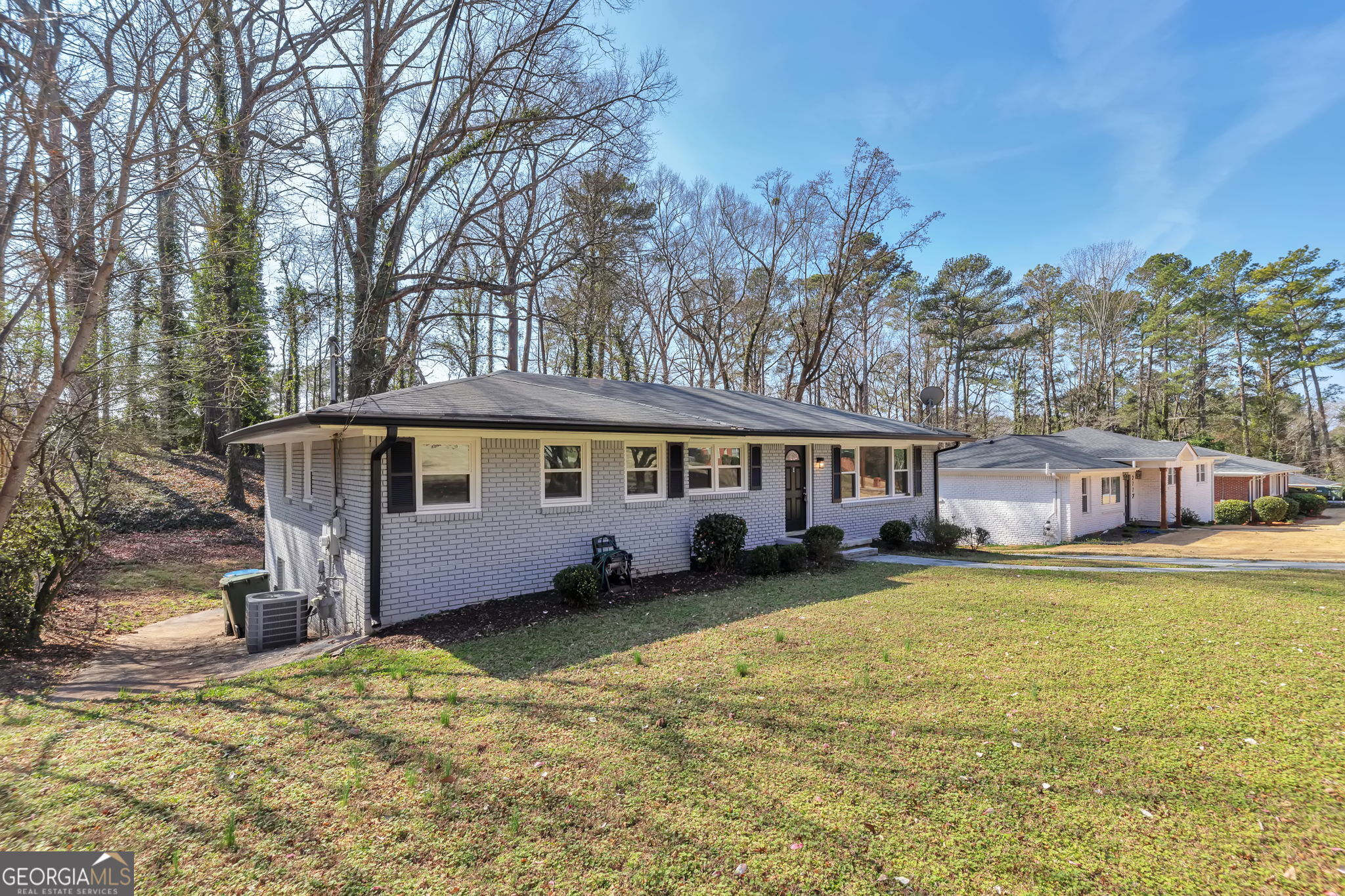 2764 Veltre Place Southwest Atlanta, GA 30311 - Photo 2 of 30 a front view of a house with garden