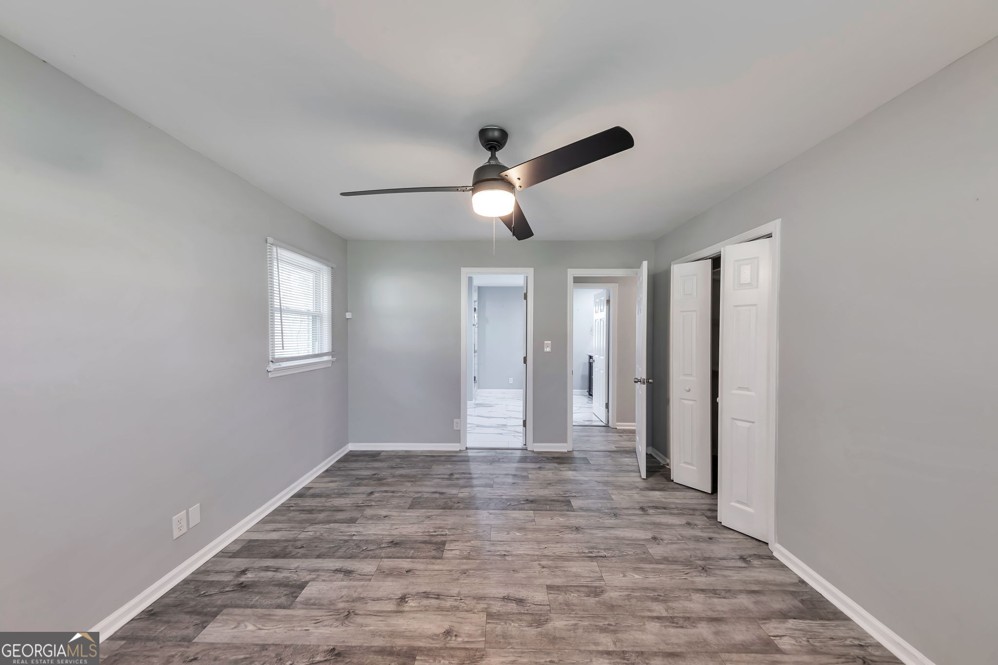 2764 Veltre Place Southwest Atlanta, GA 30311 - Photo 21 of 30 wooden floor in an empty room with a window