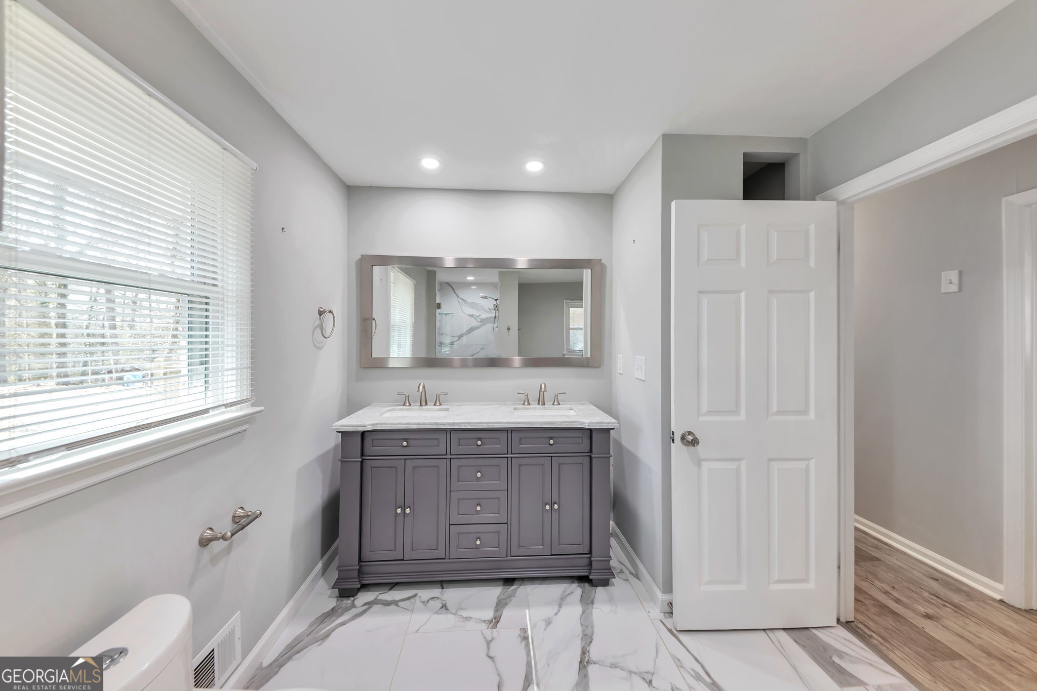 2764 Veltre Place Southwest Atlanta, GA 30311 - Photo 25 of 30 a bathroom with a granite countertop sink toilet and shower