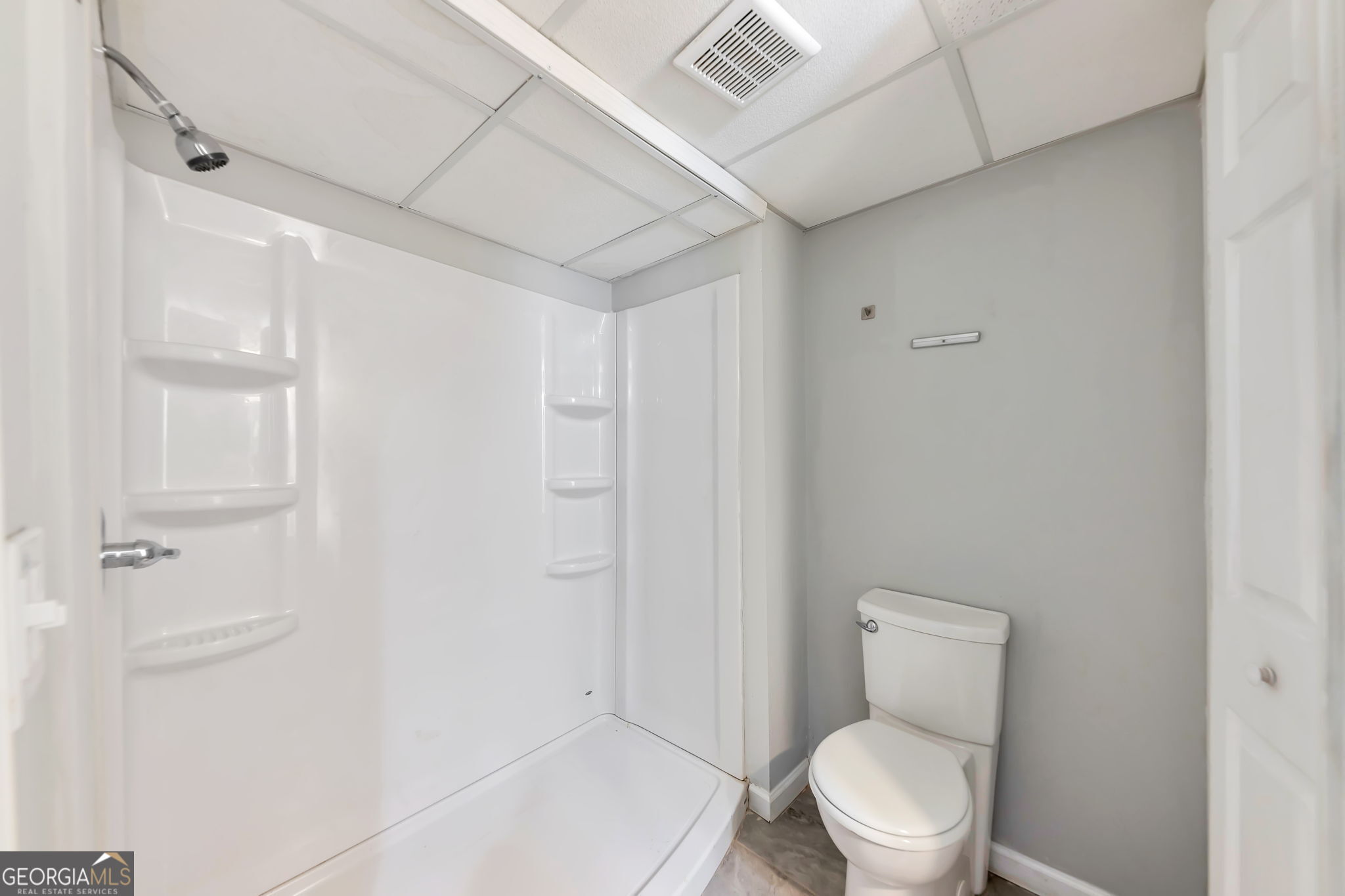 2764 Veltre Place Southwest Atlanta, GA 30311 - Photo 30 of 30 a white toilet sitting next to a bathroom sink