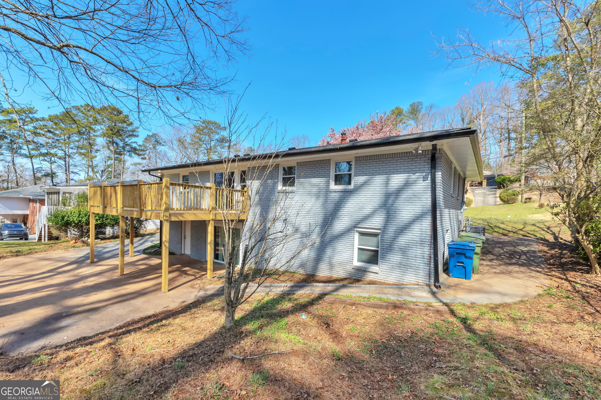 2764 Veltre Place Southwest Atlanta, GA 30311 - Photo 7 of 30 a backyard of a house with barbeque oven table and chairs
