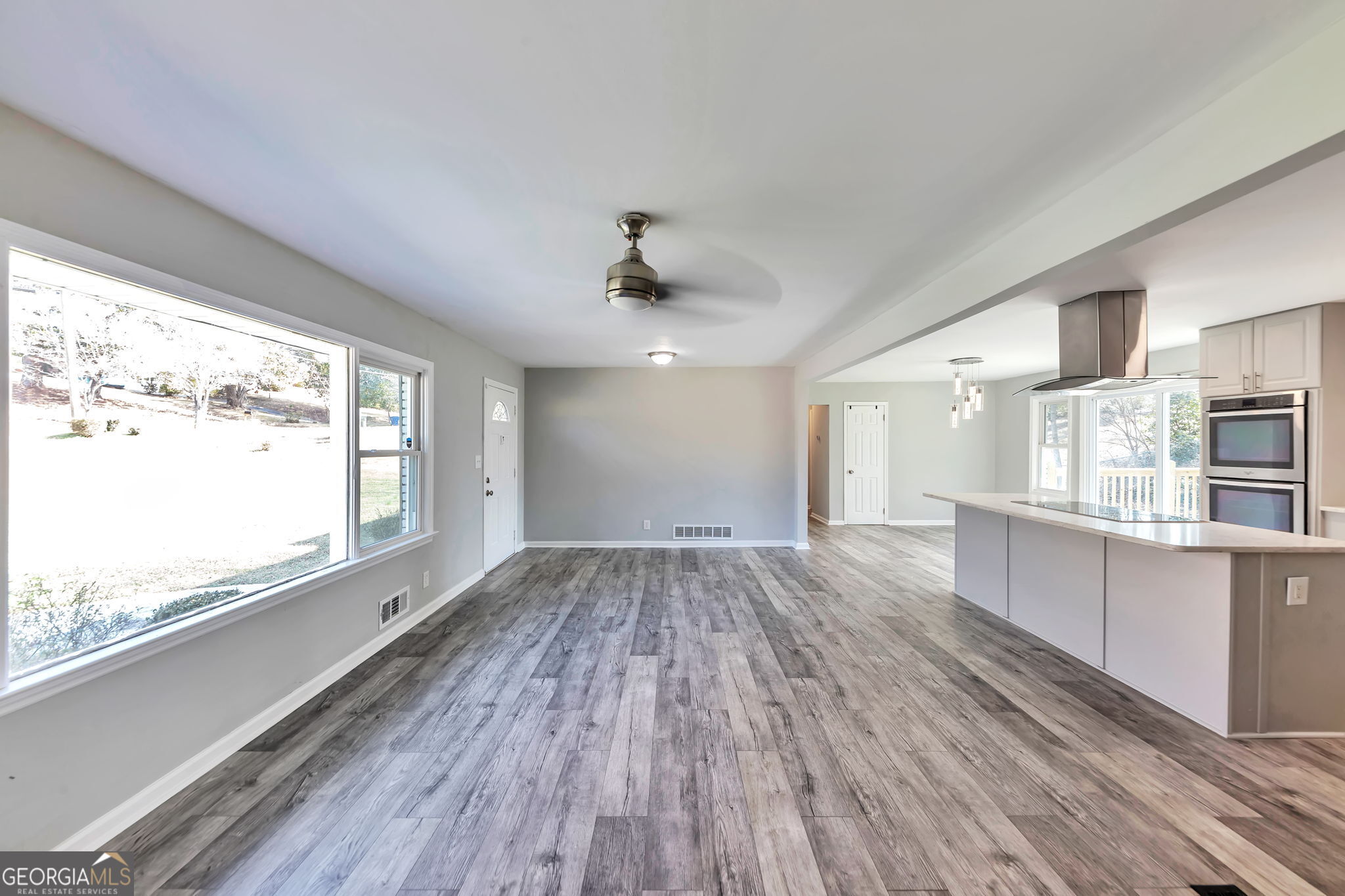 2764 Veltre Place Southwest Atlanta, GA 30311 - Photo 9 of 30 a view of a kitchen with wooden floor and a window