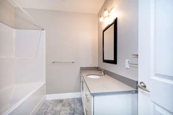 a bathroom with a sink and a mirror