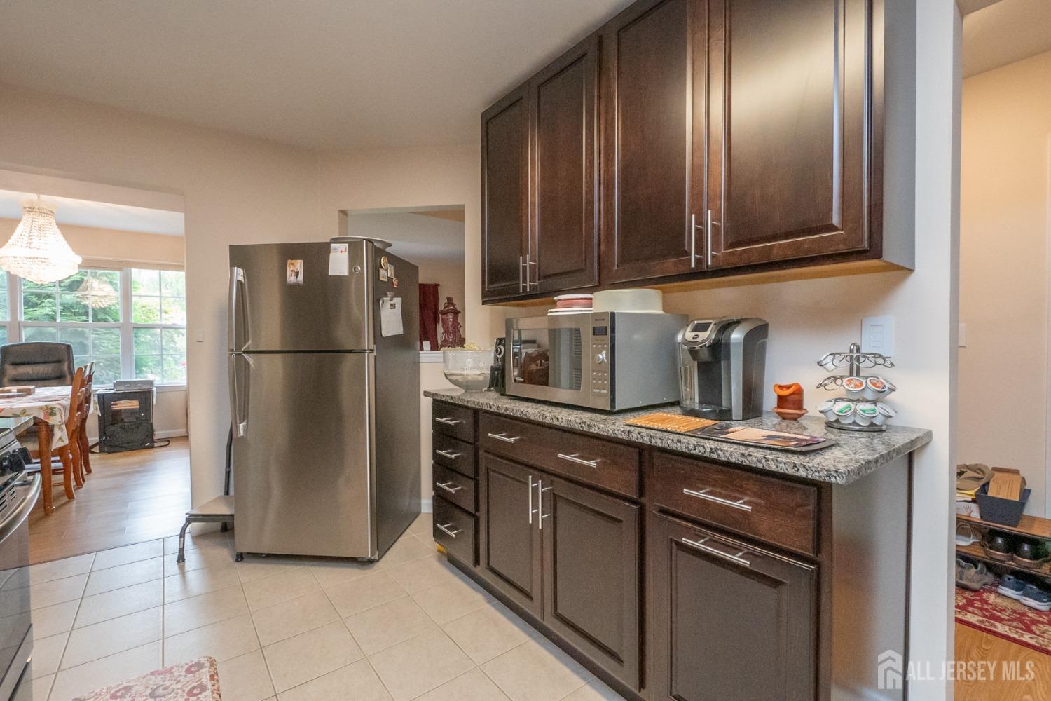 1405 Plymouth Road North Brunswick, NJ 08902 - Photo 13 of 32 a kitchen with a refrigerator and a sink