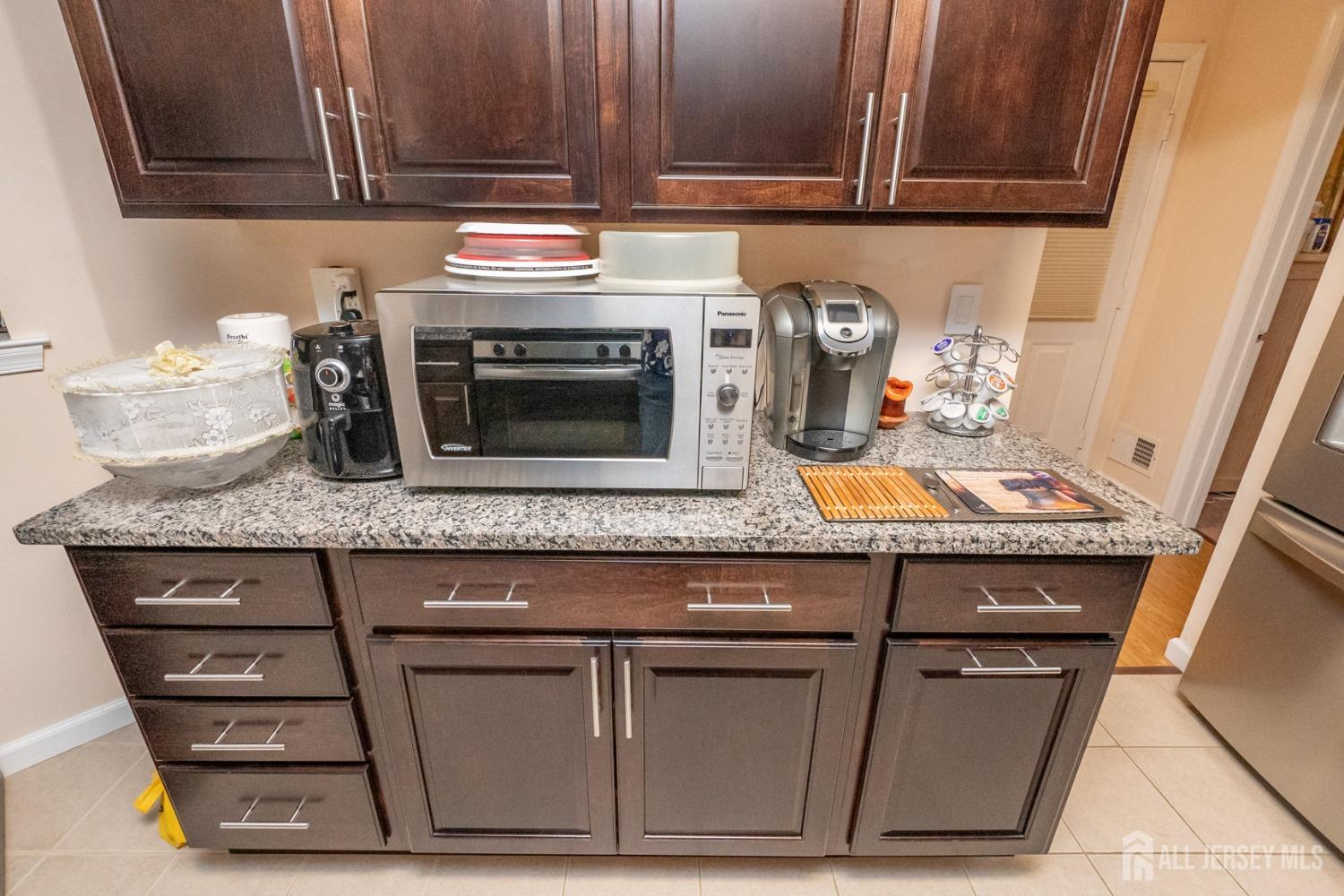 1405 Plymouth Road North Brunswick, NJ 08902 - Photo 14 of 32 a stove top oven sitting inside of a kitchen