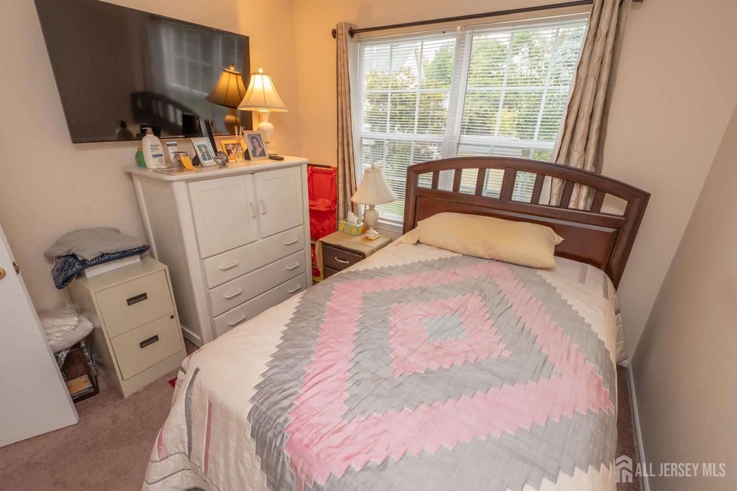 1405 Plymouth Road North Brunswick, NJ 08902 - Photo 22 of 32 a bedroom with a bed and wooden floor