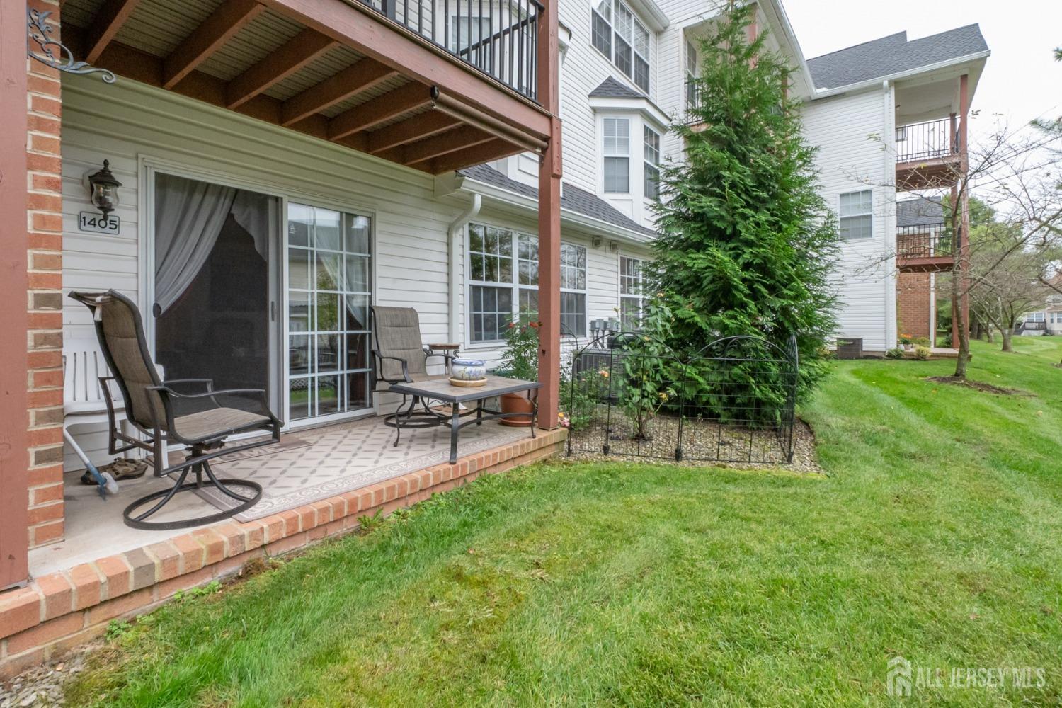 1405 Plymouth Road North Brunswick, NJ 08902 - Photo 26 of 32 a view of a backyard with sitting area and furniture