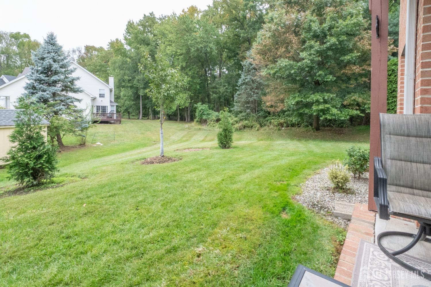 1405 Plymouth Road North Brunswick, NJ 08902 - Photo 29 of 32 a swimming pool with lots of tress in front of it