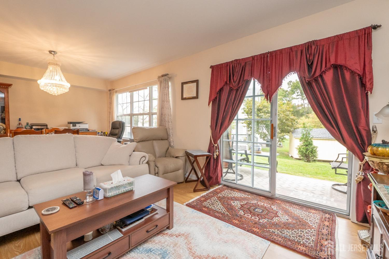 1405 Plymouth Road North Brunswick, NJ 08902 - Photo 5 of 32 a living room with furniture and a floor to ceiling window