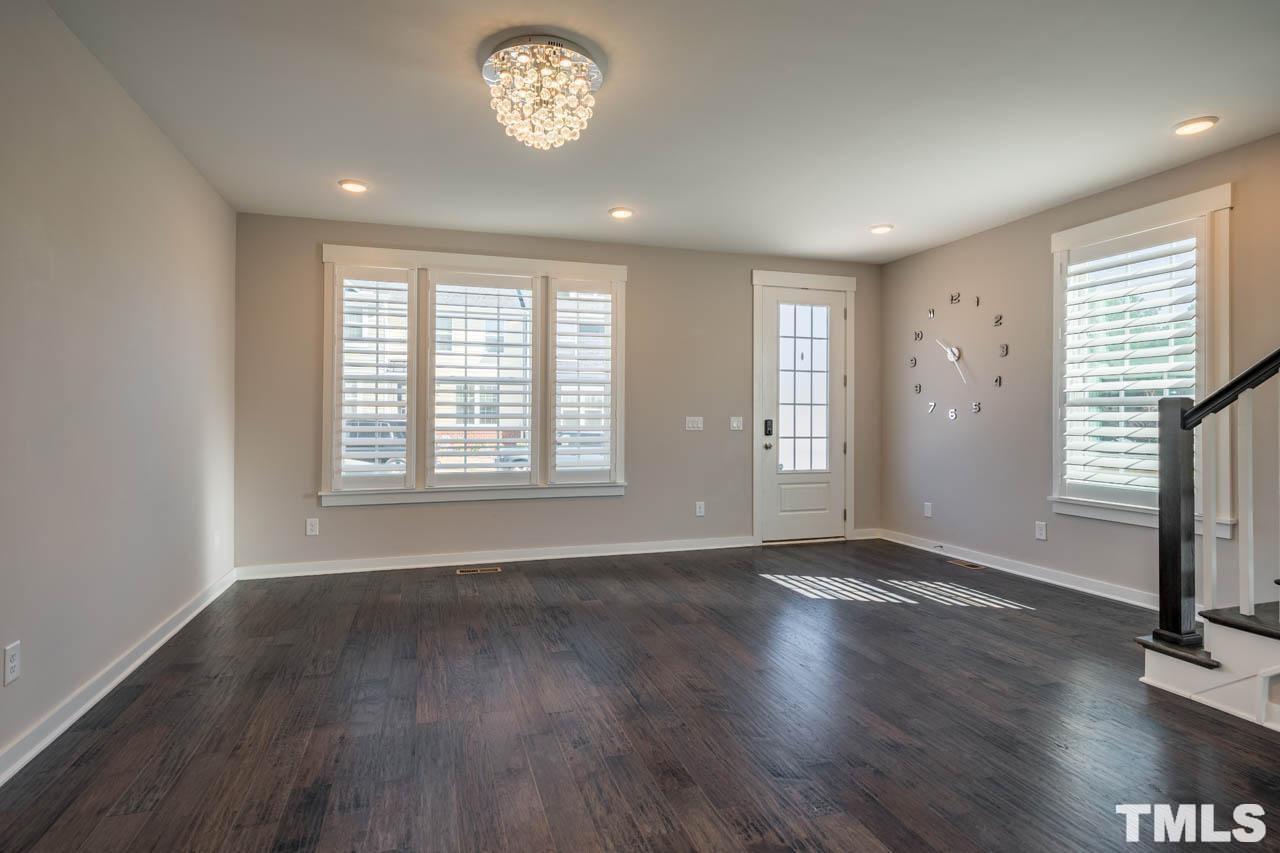 444 Rally Point Place Wake Forest, NC 27587 - Photo 11 of 38 an empty room with wooden floor and window