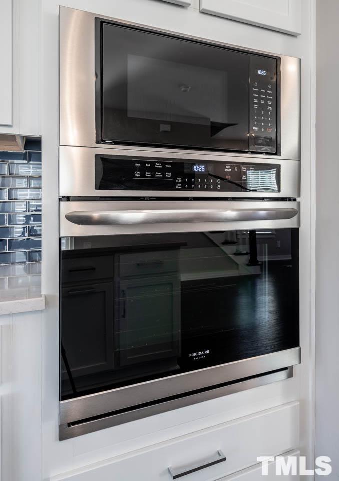 444 Rally Point Place Wake Forest, NC 27587 - Photo 20 of 38 a stove top oven sitting inside of a kitchen