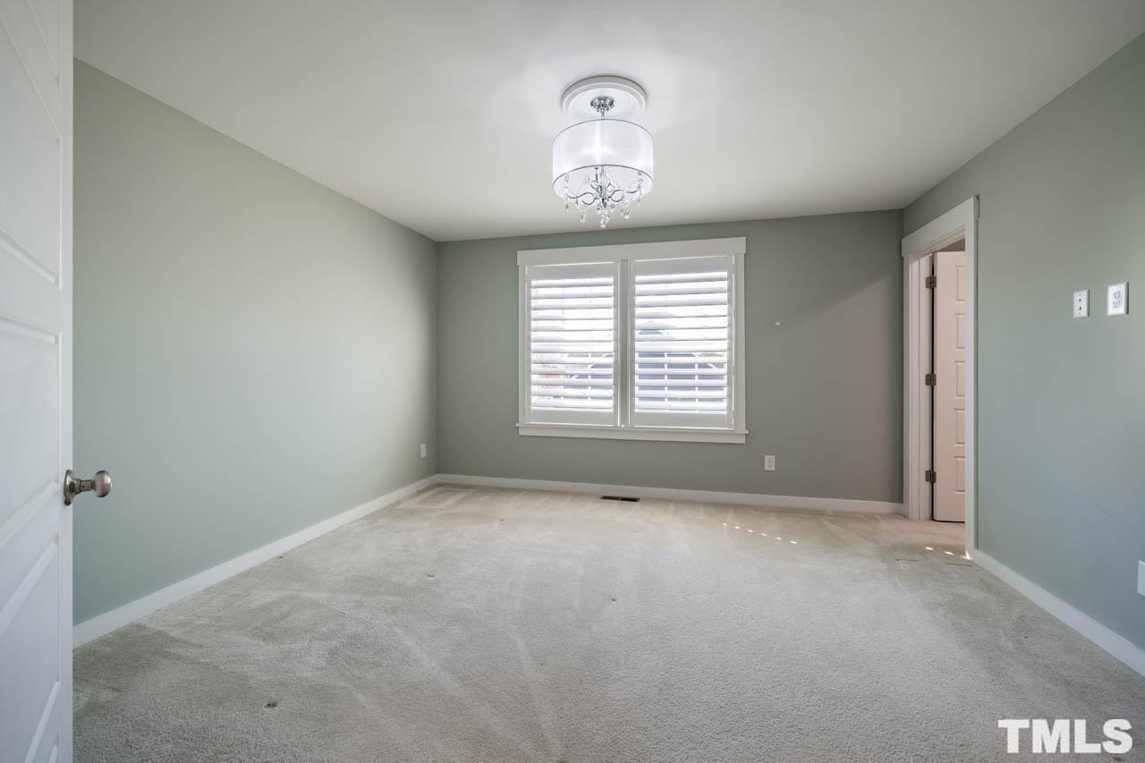 444 Rally Point Place Wake Forest, NC 27587 - Photo 25 of 38 a view of an empty room with a window