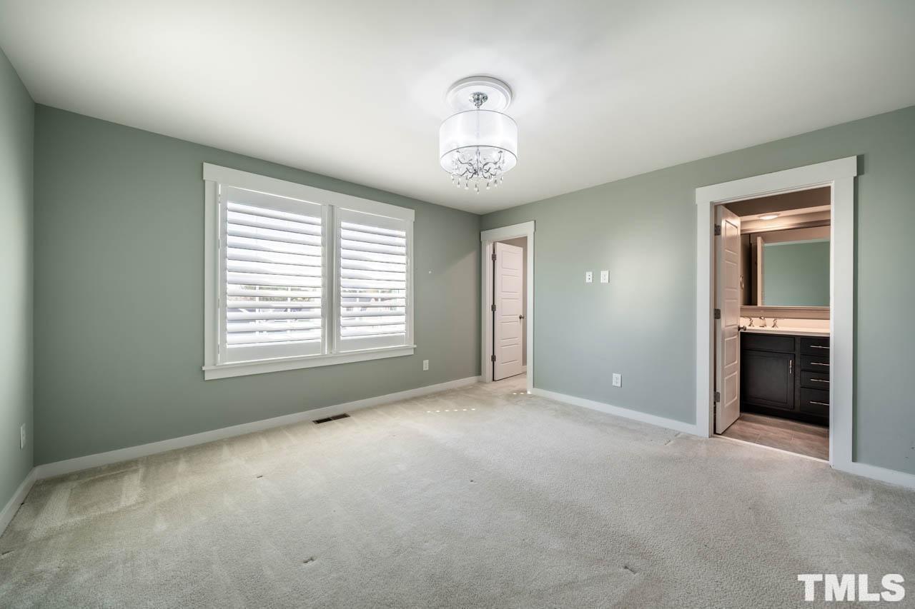 444 Rally Point Place Wake Forest, NC 27587 - Photo 28 of 38 a view of an empty room with a window