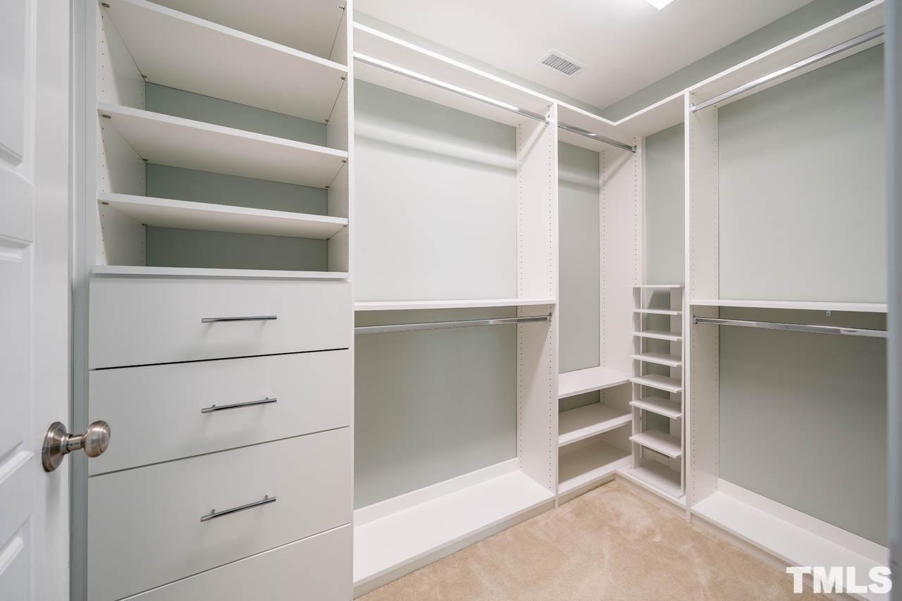 444 Rally Point Place Wake Forest, NC 27587 - Photo 29 of 38 a view of walk in closet with empty racks