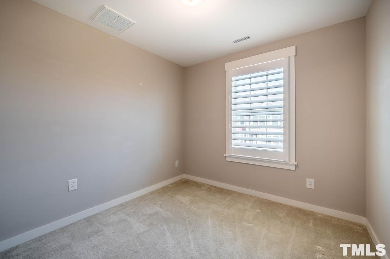 444 Rally Point Place Wake Forest, NC 27587 - Photo 34 of 38 an empty room with a window