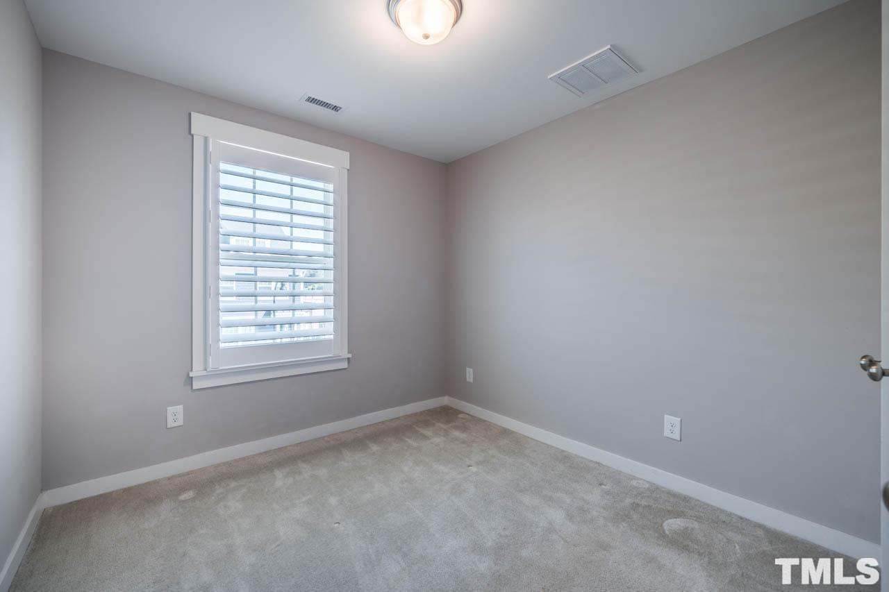444 Rally Point Place Wake Forest, NC 27587 - Photo 35 of 38 an empty room with a window