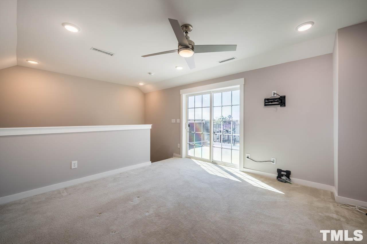 444 Rally Point Place Wake Forest, NC 27587 - Photo 37 of 38 an empty room with windows