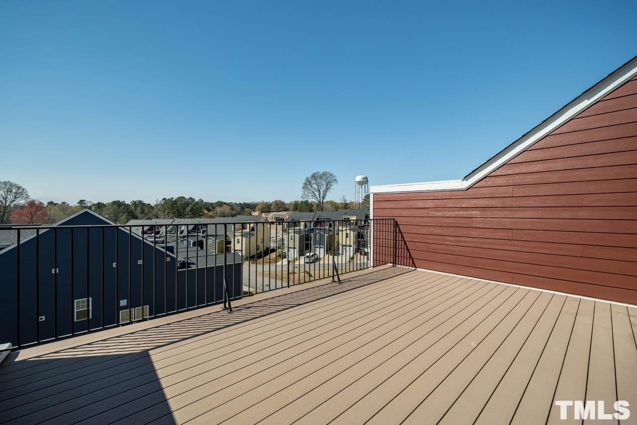 444 Rally Point Place Wake Forest, NC 27587 - Photo 38 of 38 a balcony with wooden floor