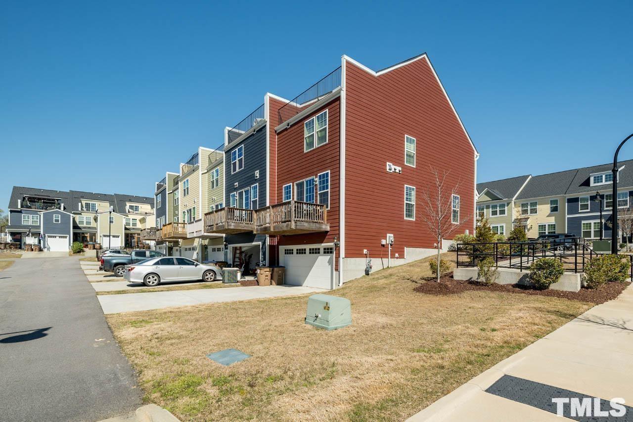 444 Rally Point Place Wake Forest, NC 27587 - Photo 4 of 38 a view of a building with cars parked