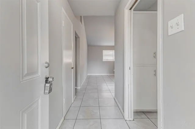 a kitchen with stainless steel appliances granite countertop a stove a sink and a white cabinets