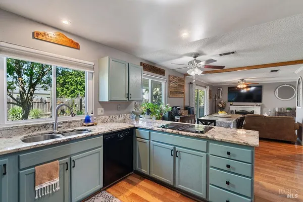 a kitchen with a sink and a large window
