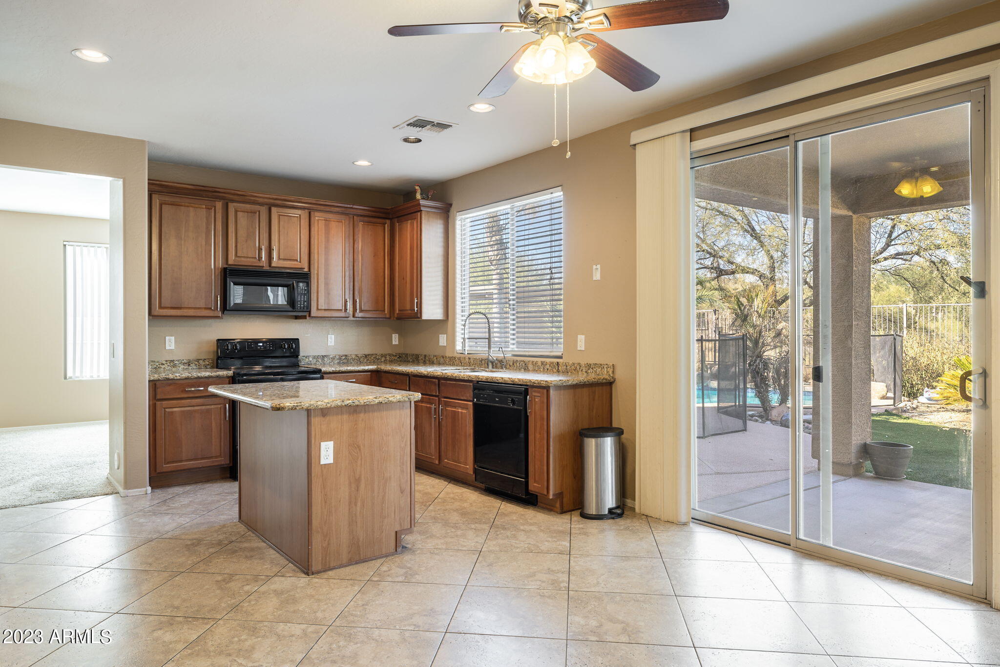 3344 West Montello Road Phoenix, AZ 85086 - Photo 3 of 38 a large kitchen with stainless steel appliances granite countertop a stove sink and cabinets